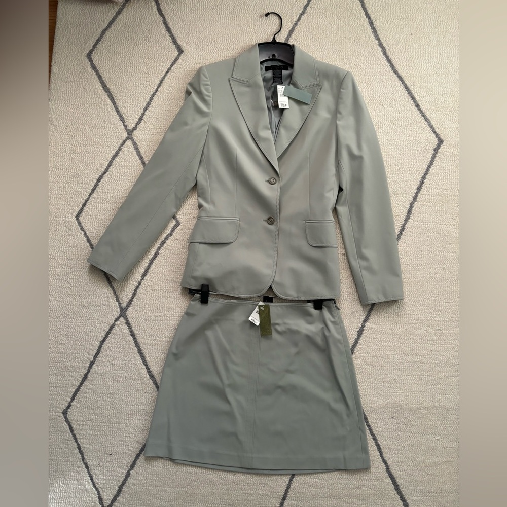 Express Suit Jacket and skirt. Jacket is size 4 and skirt is a size 6.